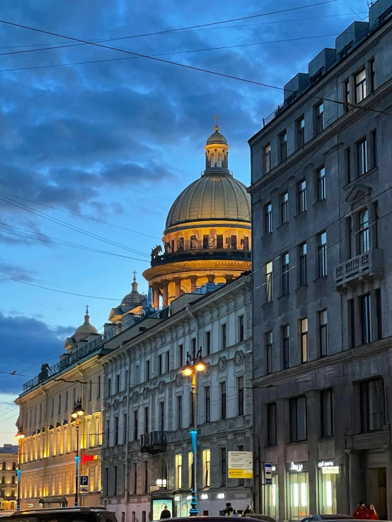 a group of cars driving down a street next to tall buildings, neoclassicism, with great domes and arches, in the evening, profile image, russian architecture