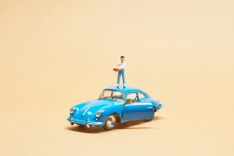 a toy car with a man standing on top of it, pexels contest winner, magic realism, porsche 356, pvc posable figure, joan cornella, illustration