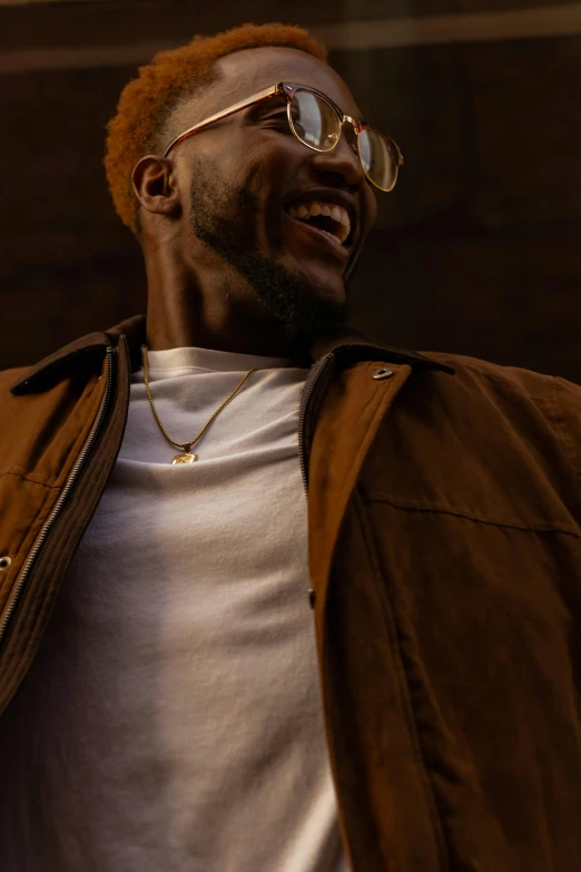 a man in a white shirt and brown jacket, inspired by Michael Ray Charles, trending on pexels, gold necklace, ashteroth, looking happy, low light cinematic