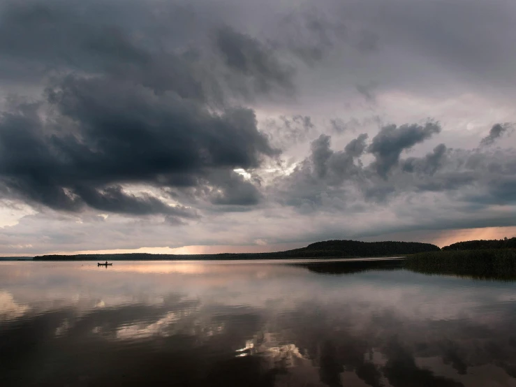 a large body of water under a cloudy sky, by Grytė Pintukaitė, unsplash contest winner, romanticism, fishing, panoramic shot, humid evening, grey