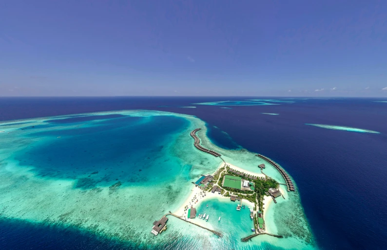 an island in the middle of the ocean, by Peter Churcher, pexels contest winner, hurufiyya, resort, wide aerial shot, side, brochure