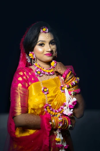 a woman dressed in a pink and yellow sari, intricate led jewellery, ready to model, bangladesh, divayth fyr