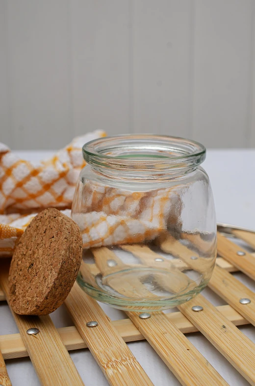 a glass jar sitting on top of a wooden table, sponge, soothing, very crisp, all around