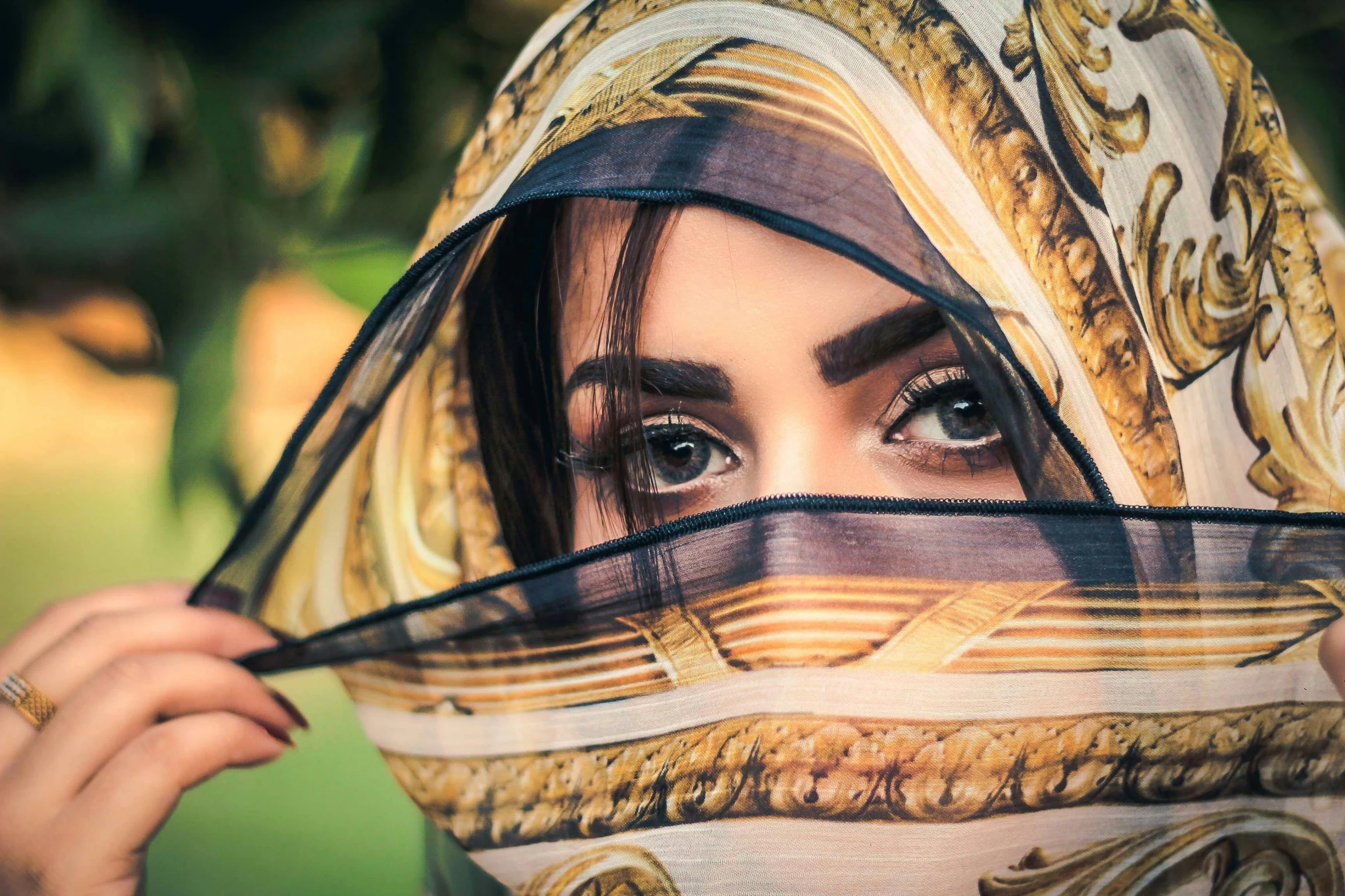 a woman wearing a scarf covering her face, trending on pixabay, hyperrealism, arabian princess, thick eyebrows, summer season, lovingly looking at camera