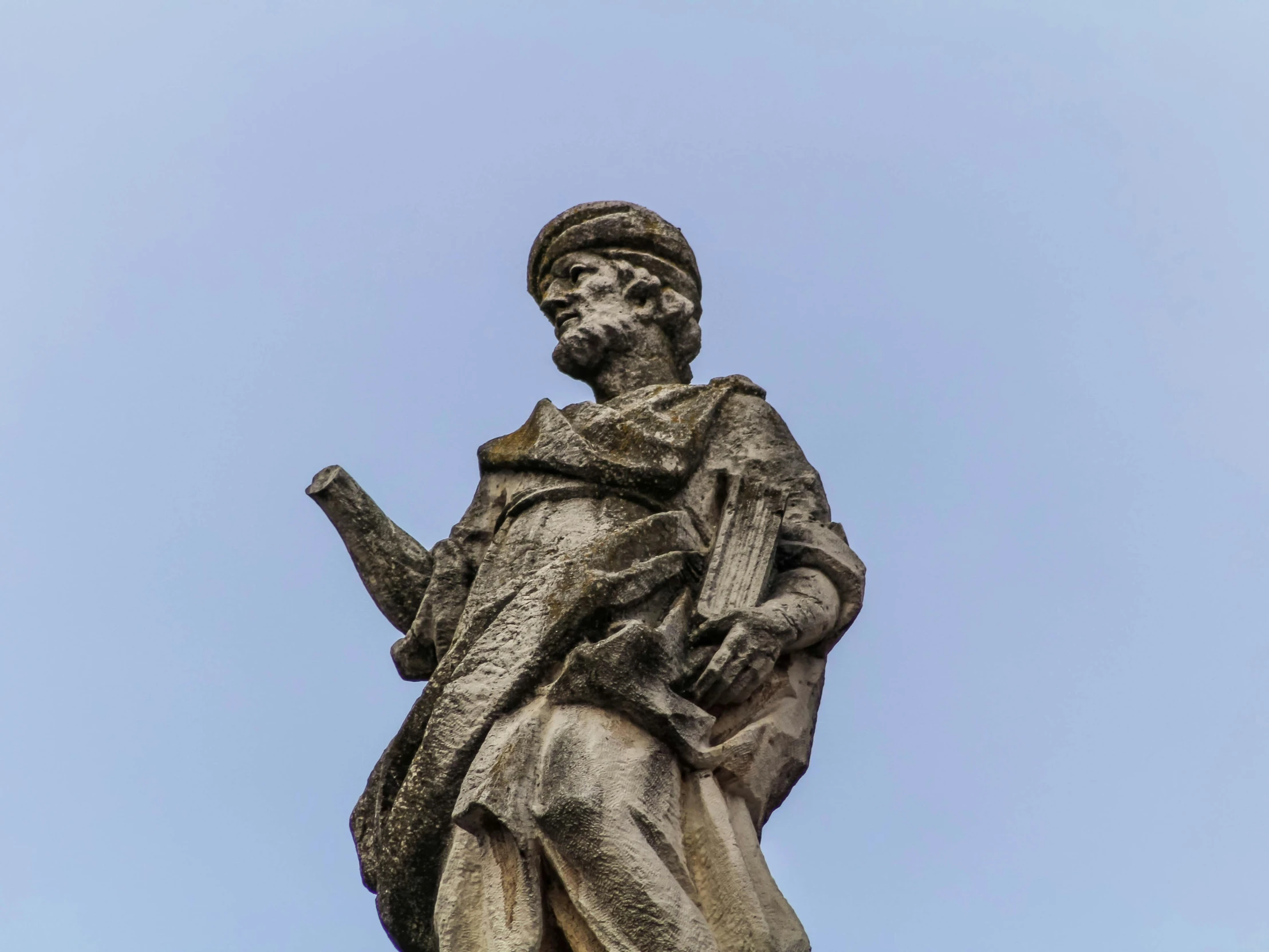 a statue of a man holding a book, a statue, inspired by Jacopo de' Barbari, unsplash, mannerism, lviv, donatello, looking upwards, sqare-jawed in medieval clothing