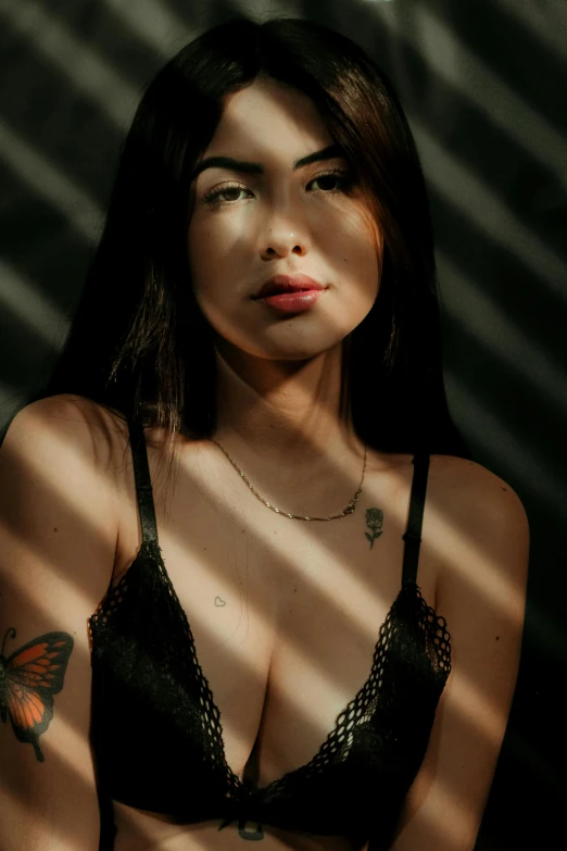 a woman with a butterfly tattoo on her chest, inspired by Elsa Bleda, pexels contest winner, portrait of modern darna, wearing black camisole outfit, 🤤 girl portrait, 5 0 0 px models