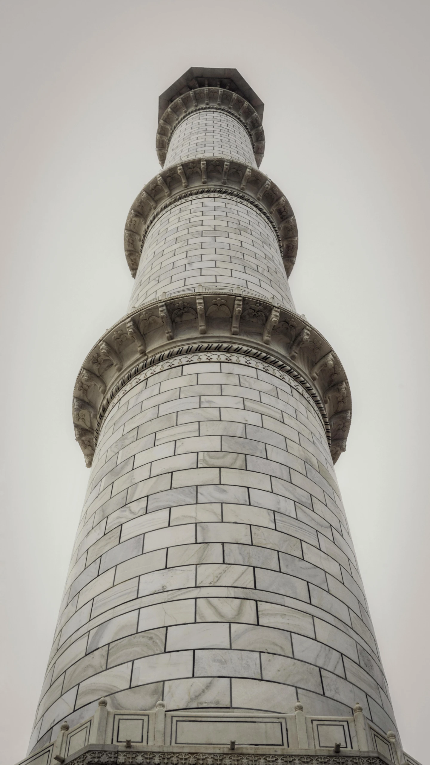 a tall tower with a clock on top of it, inspired by Zhang Kechun, unsplash, arabesque, made of carrara marble, samarkand, demur, chimneys