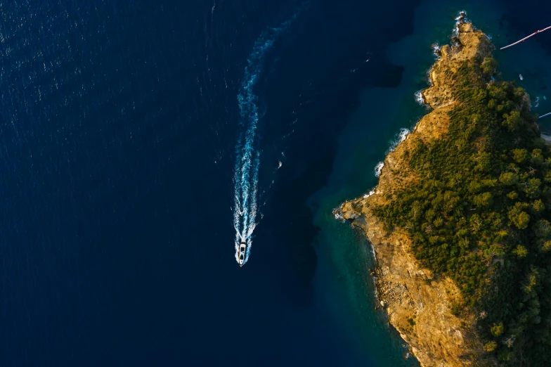 a boat in the middle of a body of water, pexels contest winner, hurufiyya, cinematic blue and gold, helicopter view, mediterranean, thumbnail