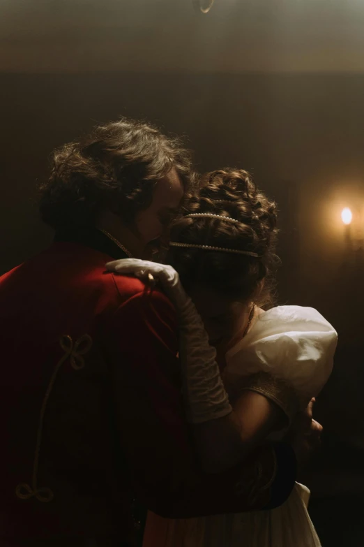 a couple of people standing next to each other, inspired by Karl Bryullov, pexels, romanticism, denis villeneuve cinematography, napoleonic wars, reylo kissing, indoor scene