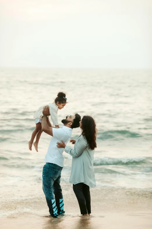 a family playing in the water at the beach, a picture, pexels contest winner, renaissance, islamic, couples portrait, square, plain background