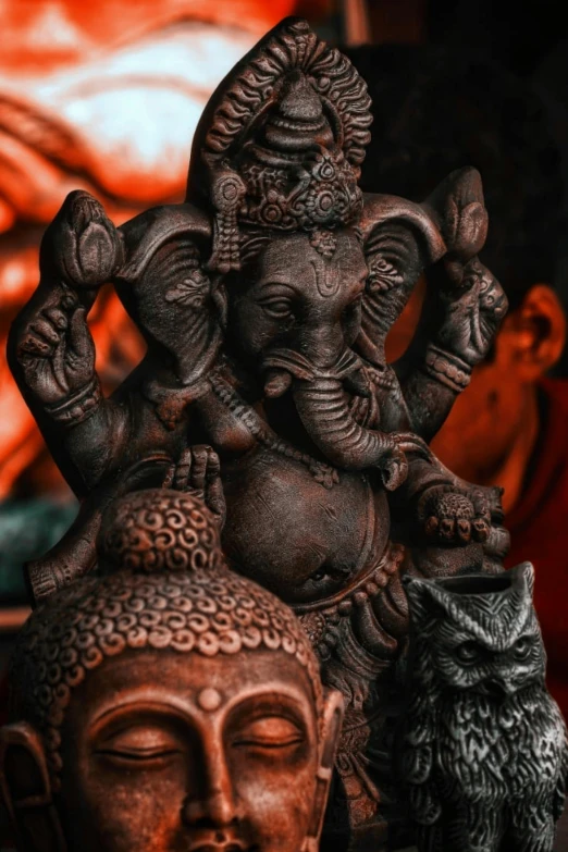 a close up of a statue of an elephant, ganesha, black and terracotta, instagram post, brown