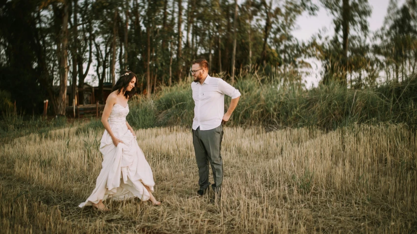 a man and a woman standing in a field, unsplash, happening, avatar image, wedding, manuka, playful