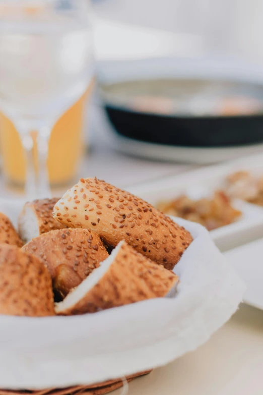 a close up of a plate of food on a table, breads, speckled, shades, banner