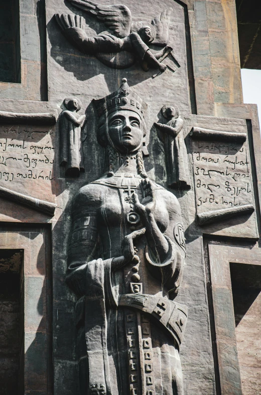 a statue of a man holding a sword in front of a building, persian queen, panel of black, stone runes on the front, georgic