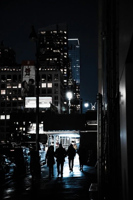 a group of people walking down a sidewalk at night, skyscrapers in the distance, with the moon out, dark alleyway, background image