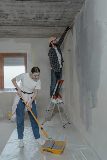 a couple of people that are standing on a ladder, a painting, trending on pexels, arbeitsrat für kunst, walls are made of dry wall, simple ceiling, thumbnail, low quality photo