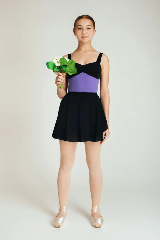 a young ballerina holding a bouquet of flowers, an album cover, tumblr, purple and black clothes, intertwined full body view, sleeveless, full shot ( fs )