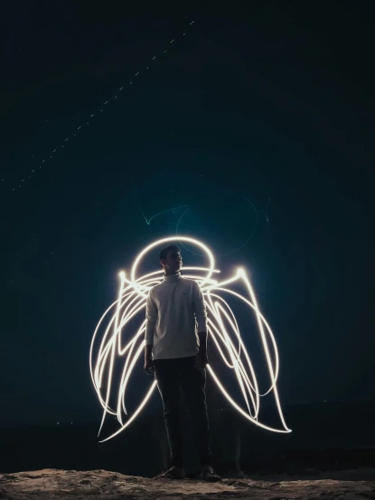 a man standing on top of a sandy beach, a picture, pexels contest winner, light and space, neon wings, wires with lights, avatar image, faceless people dark