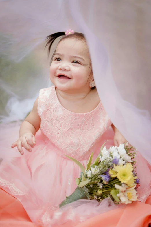 a little girl in a pink dress holding a bouquet, a picture, shutterstock contest winner, wearing organza gown, smiling playfully, toddler, alanis guillen