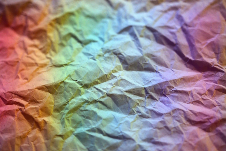 a close up of a crumpled piece of paper, by Jan Rustem, unsplash, color field, rainbow overlay! beautifully lit, normal map, yellowed paper, with instagram filters