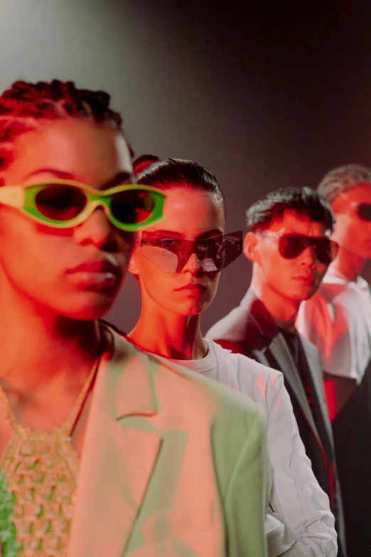 a group of people standing next to each other, trending on pexels, bauhaus, neon sunglasses!, non binary model, bella poarch, studio lit