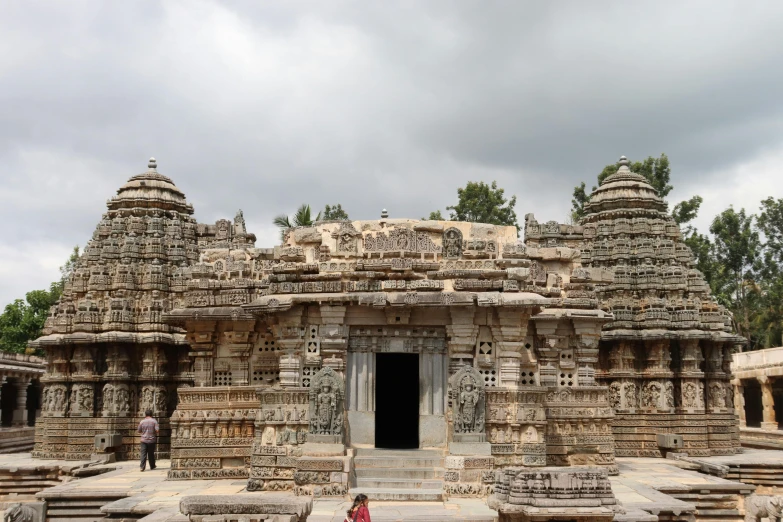 a woman standing in front of a stone structure, pexels contest winner, samikshavad, temple run, avatar image, panorama view, narasimha