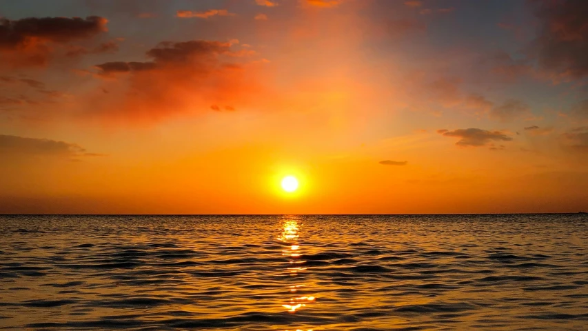 the sun is setting over a body of water, pexels, romanticism, bright yellow and red sun, calm ocean, rectangle, link