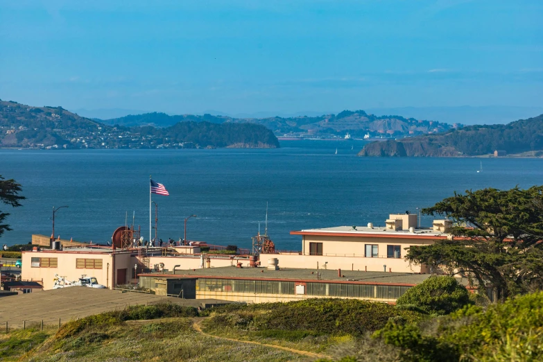 a view of the ocean from the top of a hill, a portrait, military buildings, golden gate, brown, gigapixel photo