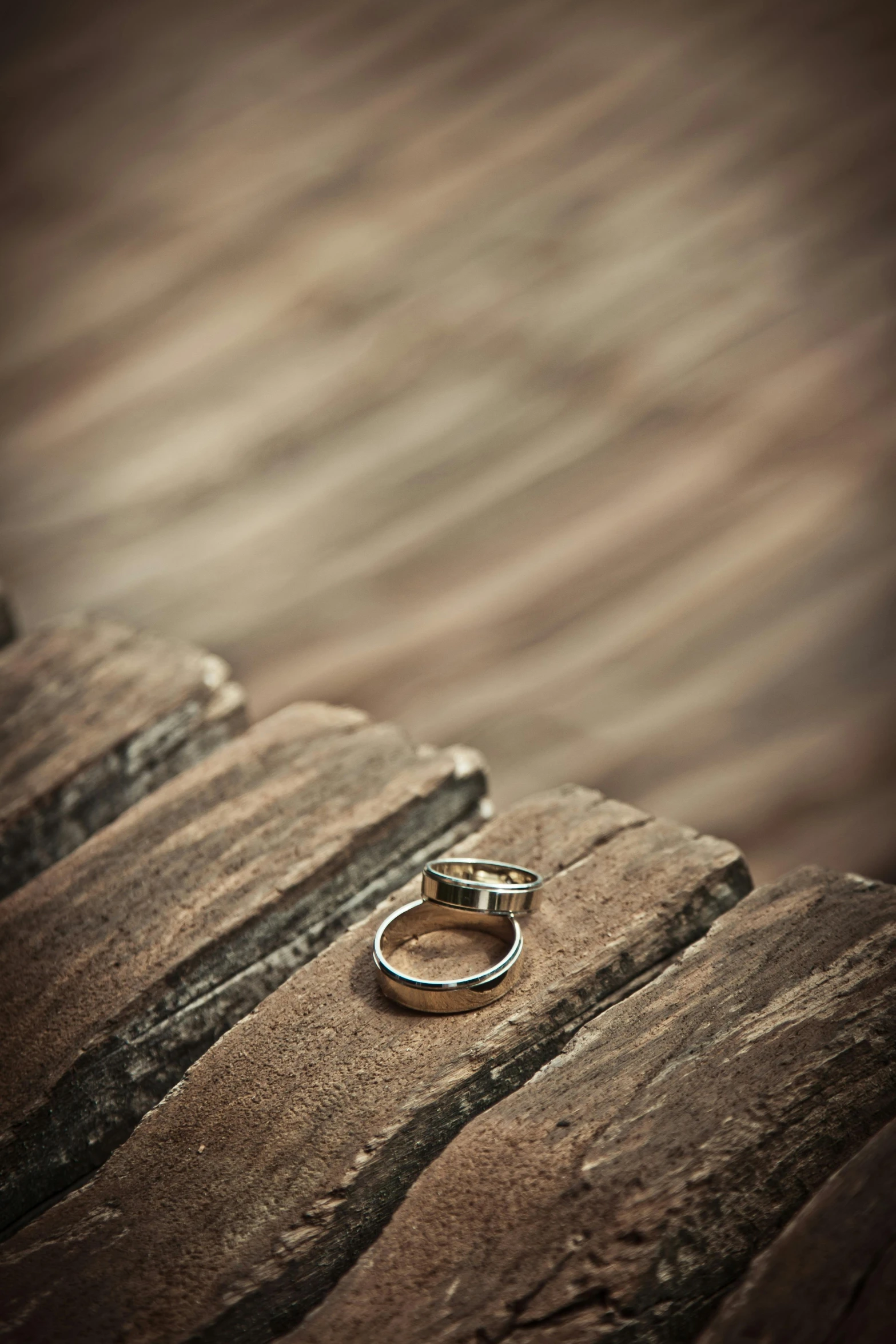 a wedding ring sitting on top of a wooden table