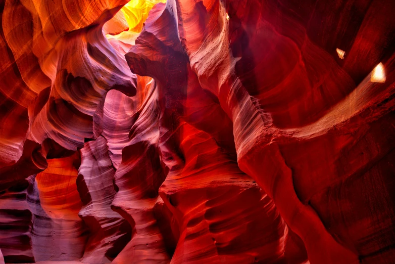 an image of the inside of a canyon, by Jessie Algie, pexels contest winner, art nouveau, bright colors with red hues, nat geo, sculpted, bells