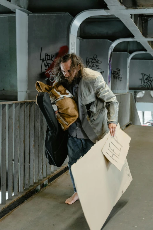 a man walking across a bridge carrying a piece of paper, poster art, by artist, unsplash, graffiti, hugging, frank dillane as puck, bags, production photo