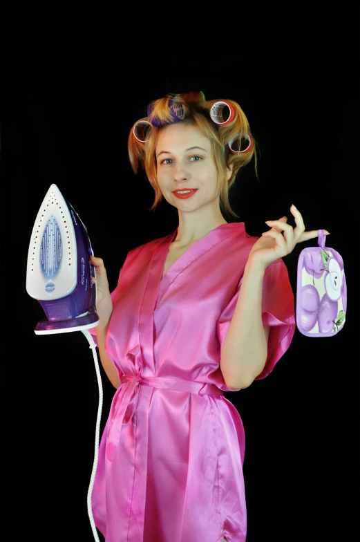 a woman in a pink robe holding an iron, pixabay contest winner, wearing purple undershirt, she has two ponytails, anna nikonova aka newmilky, designer product