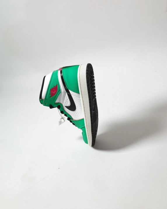 a pair of sneakers sitting on top of a white surface, an album cover, by Ben Zoeller, unsplash, hyperrealism, green legs, air jordan 1 high, view from the side, product introduction photo