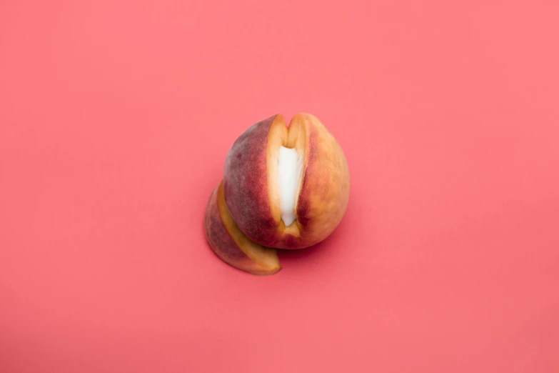 a peach sitting on top of a pink surface, by Elsa Bleda, abundant fruition seeds, the mouth a bit open, thick lining, white flesh