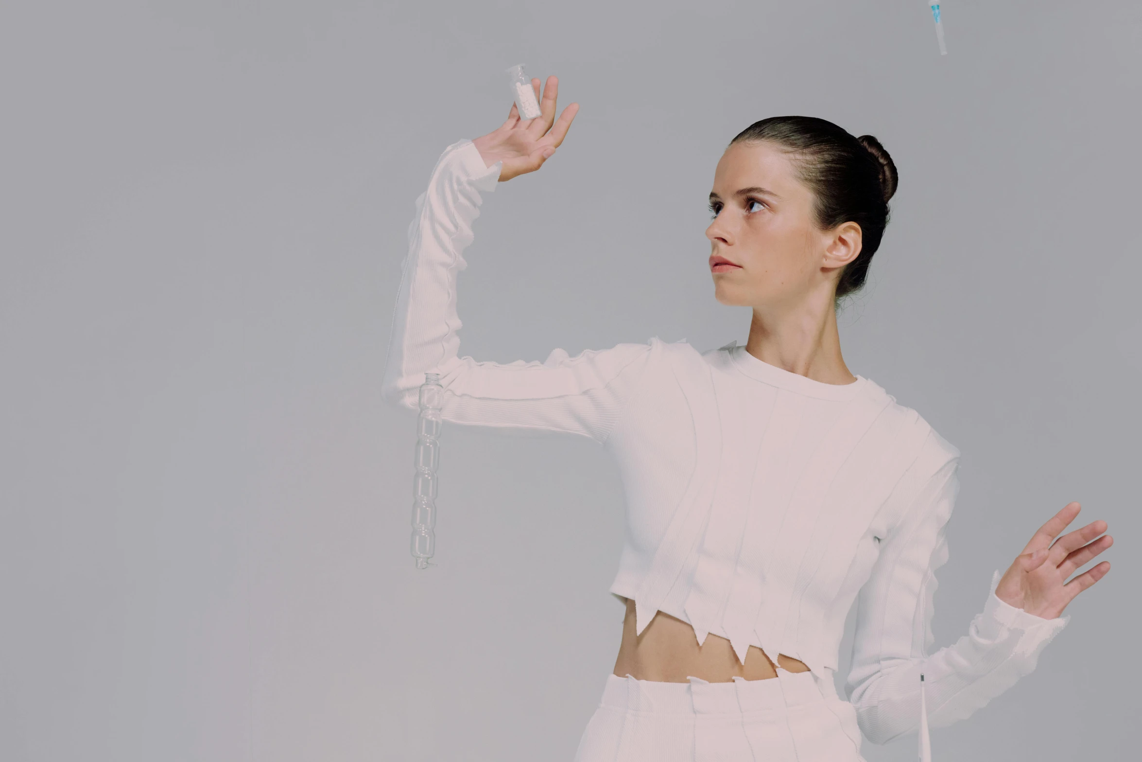 a woman in a white outfit is flying a kite, an album cover, inspired by Anna Füssli, unsplash, bauhaus, hailee steinfeld, motion capture system, photo of a hand jewellery model, fencer