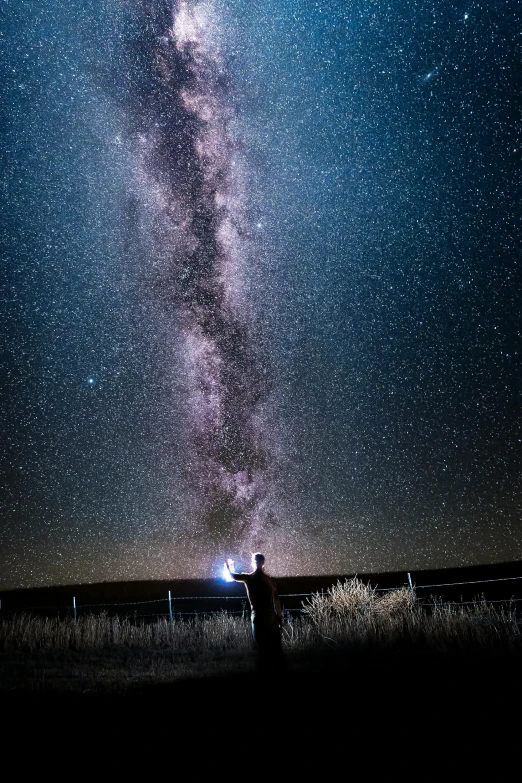 a person standing in the middle of a field under a sky full of stars, wyoming, selfie, earth seen on the dark sky, infinite