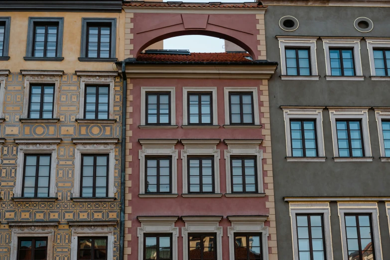 a couple of buildings that are next to each other, inspired by Lajos Gulácsy, pexels contest winner, baroque, dull colors, square, warsaw, window ( city )