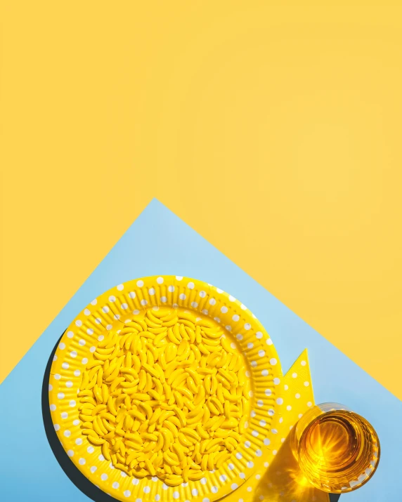 a bowl of noodles next to a glass of beer, a microscopic photo, trending on unsplash, plasticien, on yellow paper, gif, clemens ascher, bolts of bright yellow fish