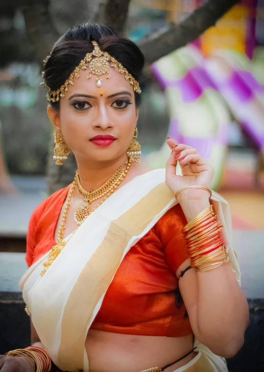 a woman in an orange and white sari, a portrait, inspired by Raja Ravi Varma, trending on cg society, color photograph portrait 4k, square, female dancer, assamese