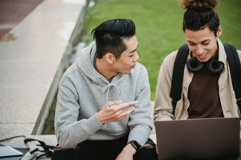 a couple of people sitting on the ground looking at a laptop, trending on pexels, university, avatar image, asian male, talking
