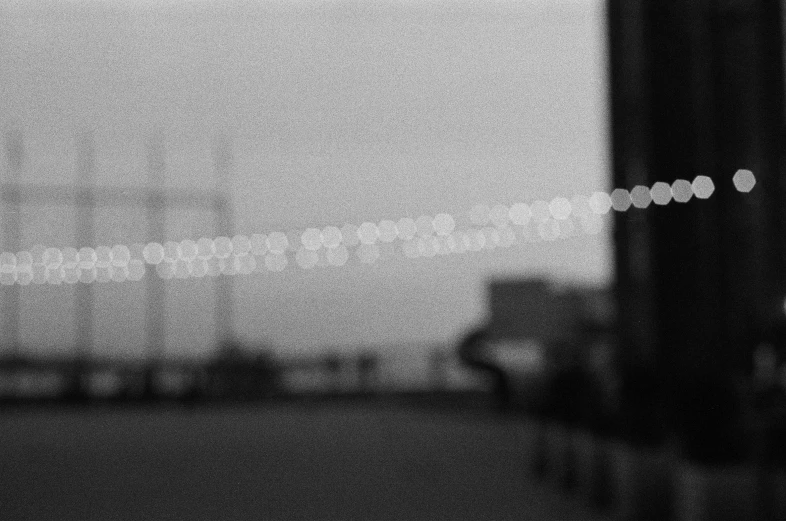 a black and white photo of a traffic light, a black and white photo, by Fujiwara Nobuzane, bokeh on side of the river, fog. by greg rutkowski, rinko kawaichi, harbor