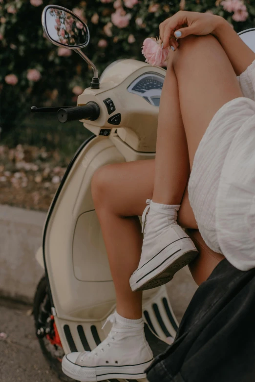 a woman sitting on the back of a scooter, trending on unsplash, legs intertwined, wearing white clothes, olive thigh skin, 🚿🗝📝