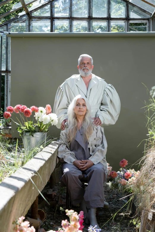 a man and a woman sitting in a greenhouse, a portrait, unsplash, international gothic, flowy white grey hair, wearing robes of silver, herman nitsch and herman nitsch, clothes made out of flower