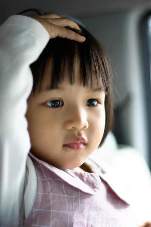 a little girl sitting in the back seat of a car, inspired by Nara Yoshitomo, visual art, caring fatherly wide forehead, looking serious, square, ethnicity : japanese