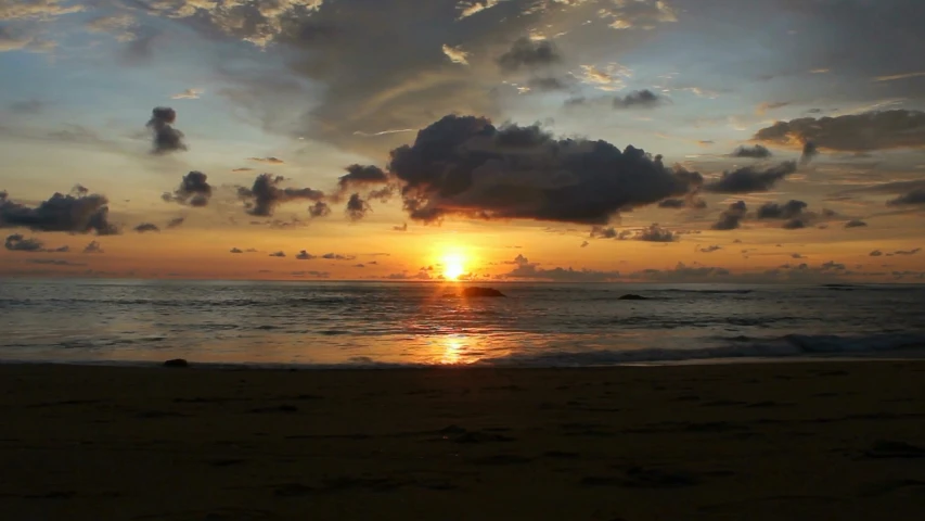 the sun is setting over the ocean on the beach, a picture, by Robbie Trevino, sri lanka, slide show, waking up, uploaded