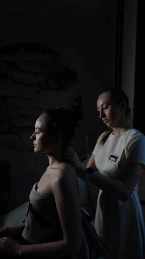 a woman getting her hair done in a dark room, by Adam Marczyński, low quality photo, lesbians, spa, 8k octan photo