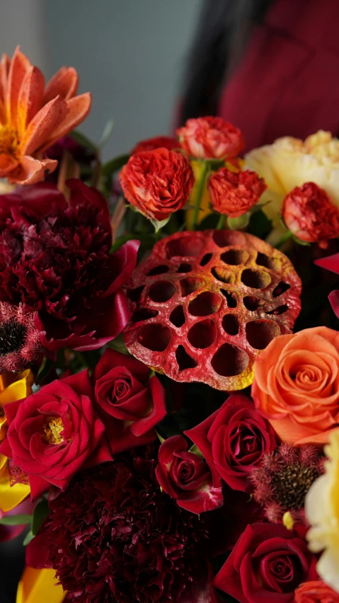 a close up of a bouquet of flowers on a table, inspired by François Boquet, vanitas, vivid ember colors, trypophobia, rich colour scheme, embossed