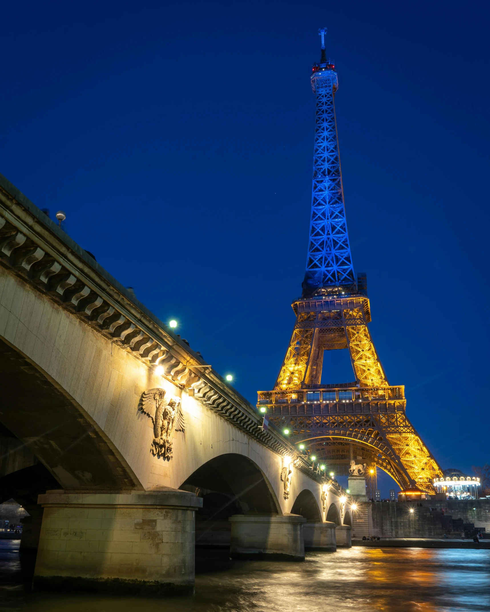 the eiffel tower is lit up at night, pexels contest winner, lgbt, last photo ever taken, fan favorite, photo of crocodile