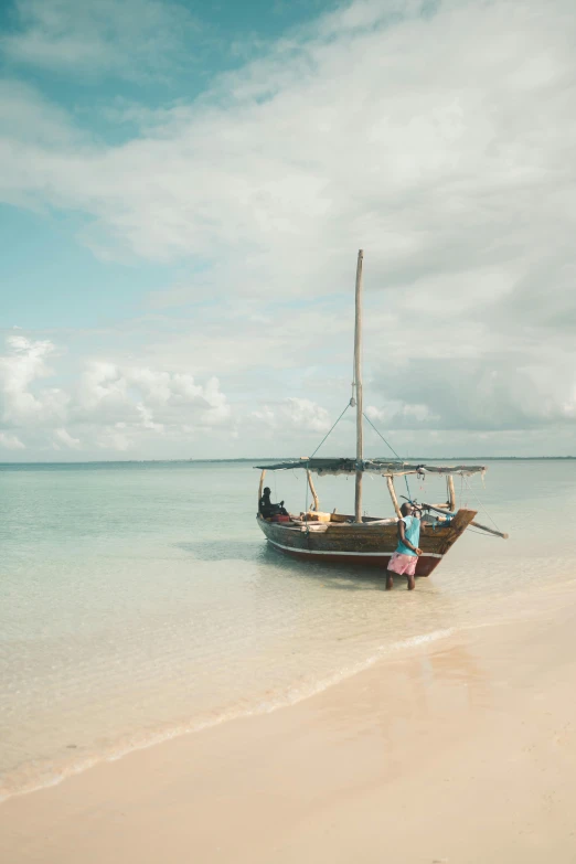 a boat sitting on top of a sandy beach, hurufiyya, unmistakably kenyan, vintage color, clear blue water, award-winning photo