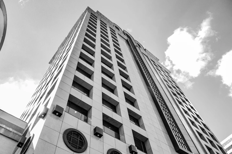 a black and white photo of a tall building, by Mike Bierek, corporate memphis, six point perspective, high quality upload, white building